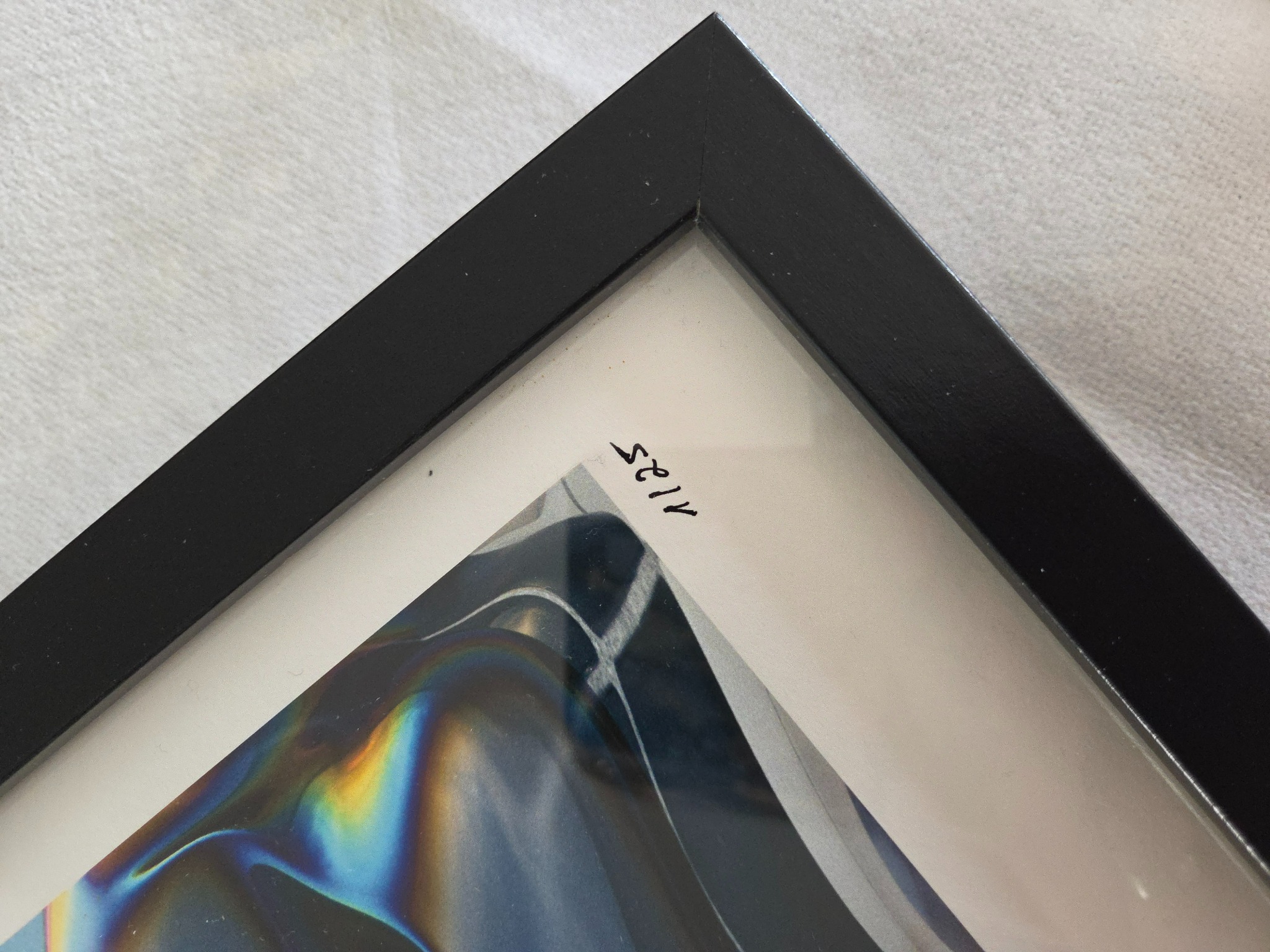 Close-up of the black wood frame used for Jessica Avarello fine art editions